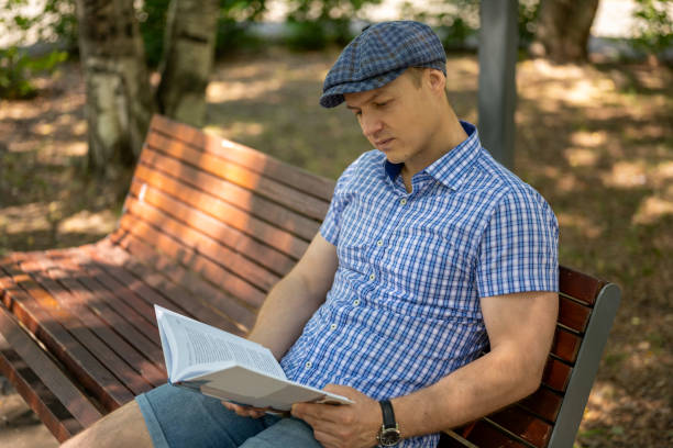 Man sitting on a green box