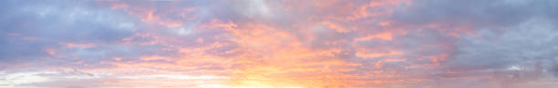 istock Panoramic bright colorful sunset sky with clouds, nature background 1380606967