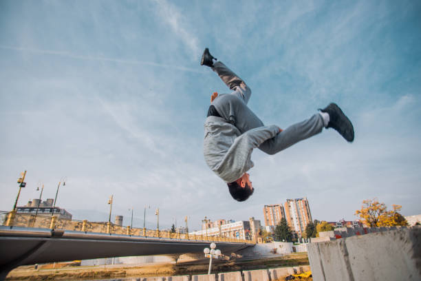 istock Young free runner making parkour at the park 1380607485