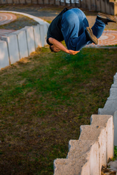istock Tracer man training running and jumping over obstacles 1380607513