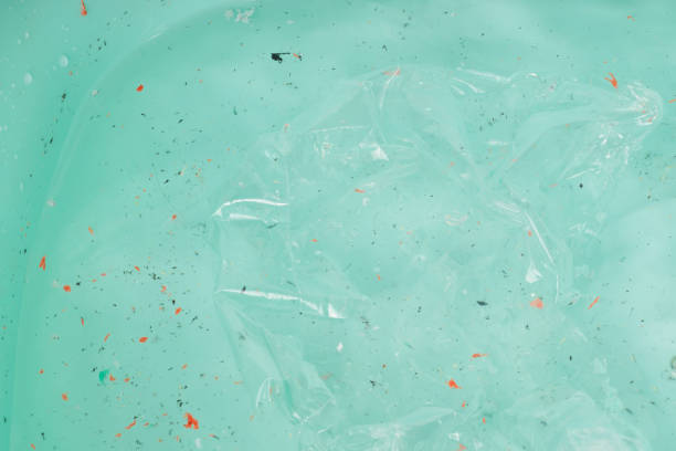 istock Plastic in the blue ocean, pollution. Climate change. 1380614647
