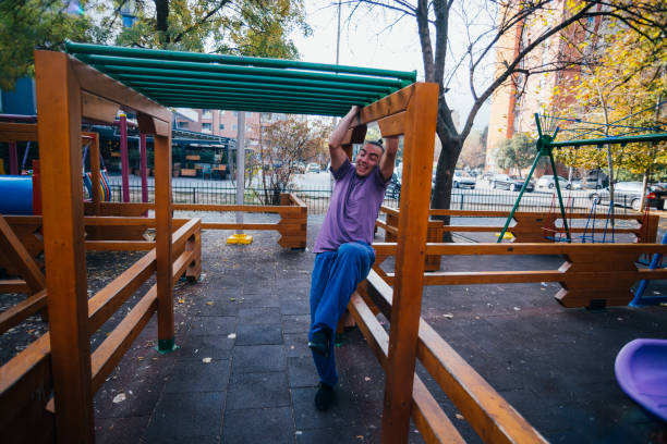 istock Young parkour guy doing tricks, flips and exercising at a playground. 1380617579