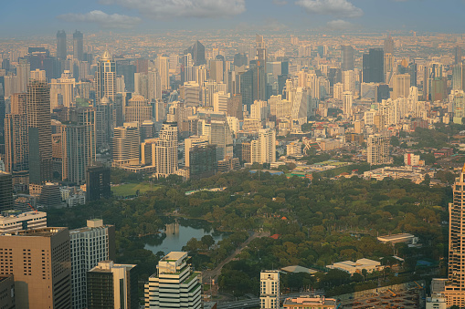 Aerial view of Bangkok modern office buildings, condominium and park living place in Bangkok city