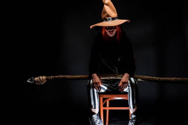Studio fashion portrait of a modern girl wearing stylish wizard costume