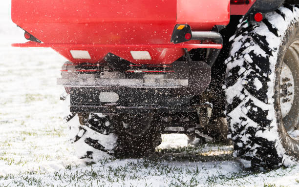 istock Farmer with tractor seeding - sowing crops at agricultural fields in winter 1380627115
