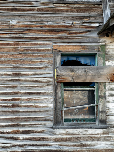 istock Abandon hotel window boarded up with weathered wood 1380652939