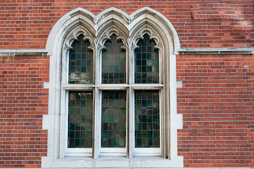 Beautiful window in gothic style. Three arches. London city, United Kingdom