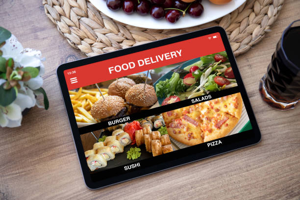 istock computer tablet with app food delivery on screen in cafe 1380659784