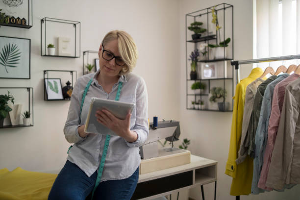 istock Young woman is sewing 1380671930