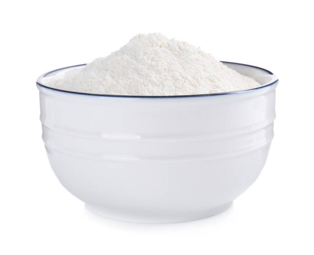 istock Organic flour in ceramic bowl isolated on white. 1380680443