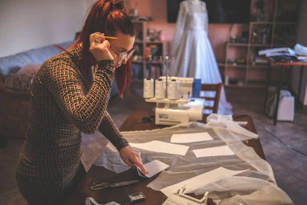 istock Making a design for wedding garment out of paper 1380683190