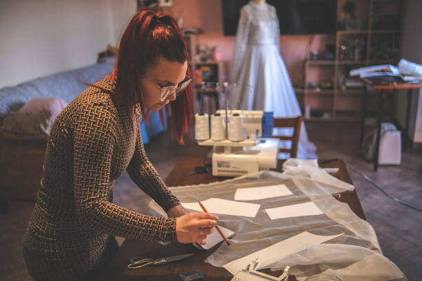 istock Making a design for wedding garment out of paper 1380683192