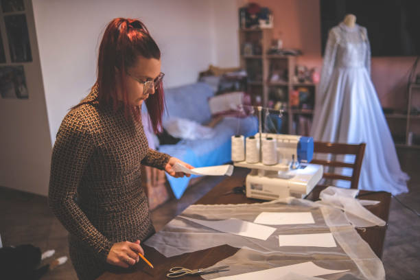 istock Making a design for wedding garment out of paper 1380683264