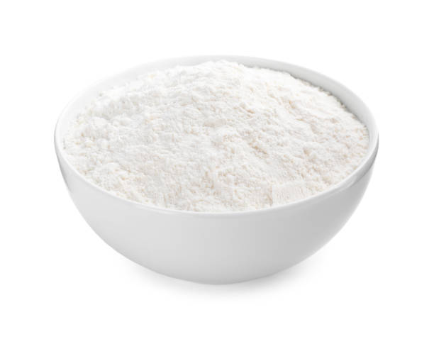 istock Organic flour in ceramic bowl isolated on white. 1380683390