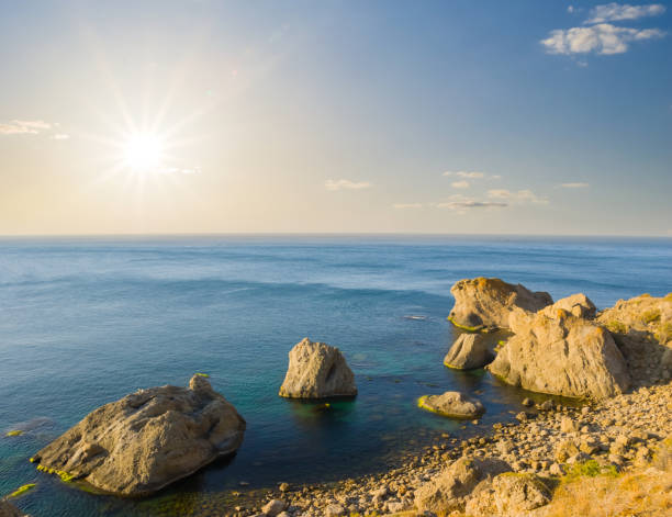 istock quiet sea  bay at the sunset 1380696473