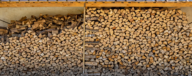Woodshed full of well placed firewood