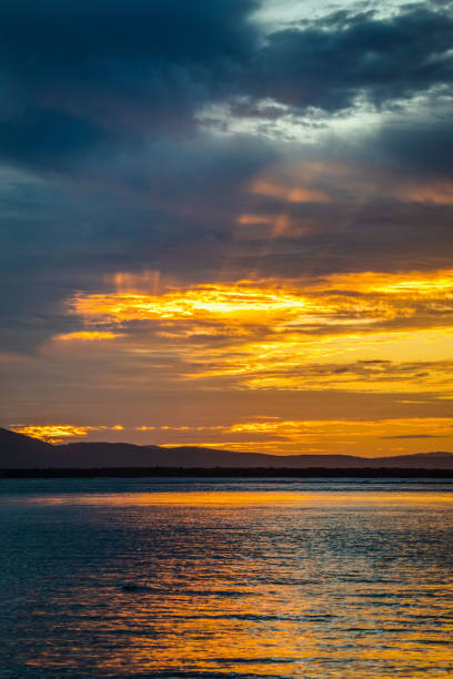 Sunset over Bustard Bay Seventeen Seventy 1770, orange sunset over Bustard Bay at the town of Seventeen Seventy,