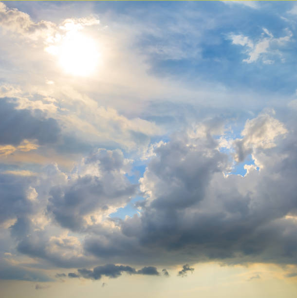 istock dramatic cloudy sky with sparkle sun, natural sunny sky background 1380700878