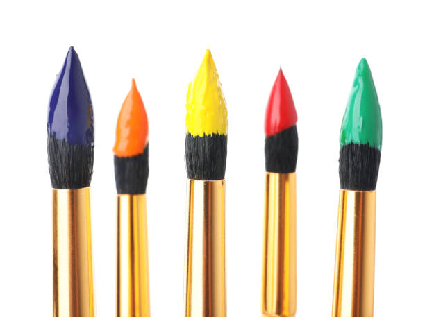 istock Brushes with colorful paints on white background 1380702541