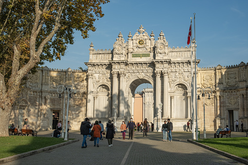 Dolmabahce Palace and historical gate or entrance of Dolmabahce Palace in Istanbul, Turkey.
