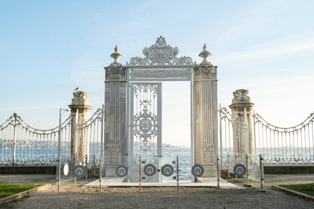 Dolmabahce Palace gate to the Bosporus in istanbul, Turkey. Dolmabahce Palace gate to the Bosporus in istanbul, Turkey. Dolmabahce Palace is one of the most popular historical museum and structure in Istanbul, Turkey. palace photos stock pictures, royalty-free photos & images