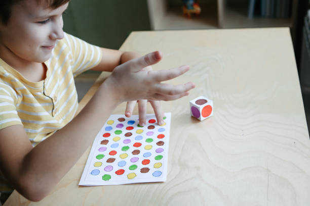 istock Child playing diy dot game for fingers 1380711473
