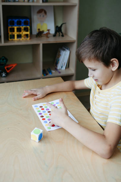 istock Child playing diy dot game for fingers 1380711541
