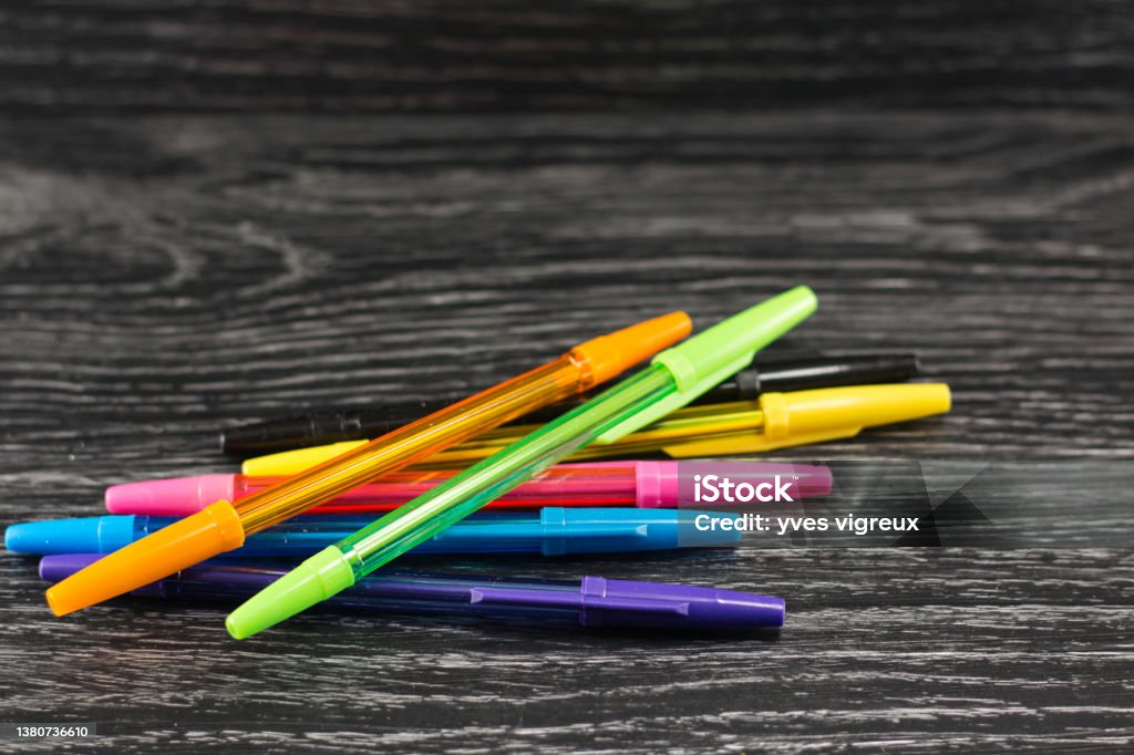 colorful pens on a black table c oloful pen staging on a table Art Stock Photo