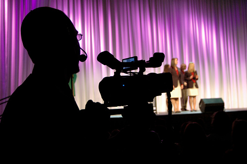  camera man filming a competition. 