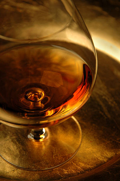 Wine Glass Drink Alcohol Glass of Cognac, Warn Golden Tones brandy photos stock pictures, royalty-free photos & images