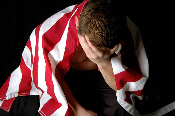 istock Young Man Draped in American Flag 138074012