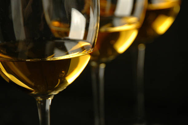 White Wine in Glasses 3 glasses of white wine chardonnay grape stock pictures, royalty-free photos & images