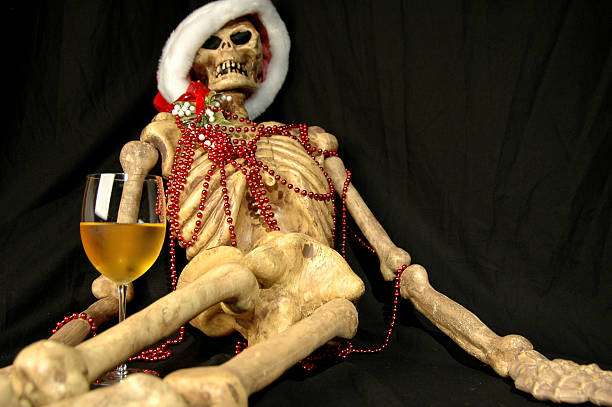 Don't drink and drive skeleton with a drink and a santa hat on pitter stock pictures, royalty-free photos & images
