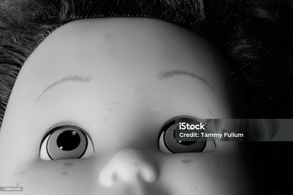 One of Chuck's Buddies doll head, desaturated, tight shot, close up on eyes. Chuck - Drill Part Stock Photo