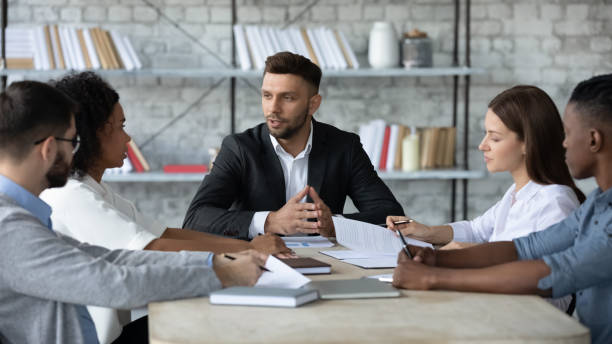 istock Diverse businesspeople discuss business ideas in office 1380764273