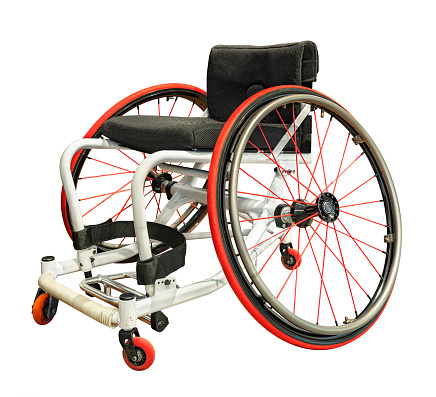Clipping isolated photography of a sports professional wheelchair with a pronounced negative camber for the wheels used by disabled athletes in wheelchair basketball.