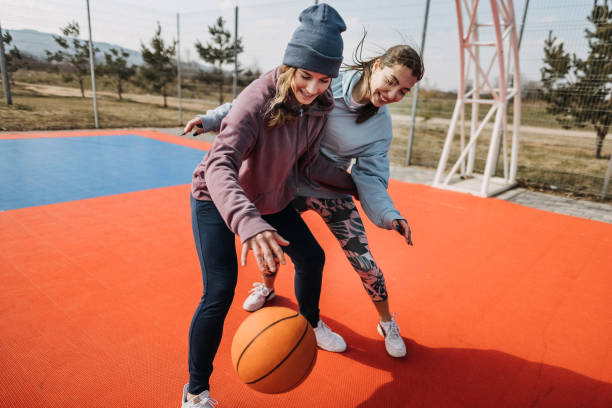 istock Girls playing basketball 1380768405
