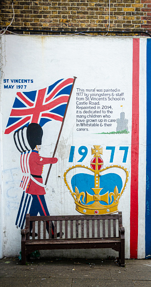Whitsable, Kent, UK, February 2021 - Queen Elizabeth's silver Jubilee mural on a building wall in the seaside town of Whitstable, Kent, UK