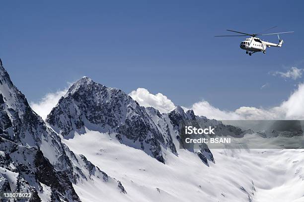 Helicopter In High Mountains Stock Photo - Download Image Now - Heli-Skiing, Beauty In Nature, Blue