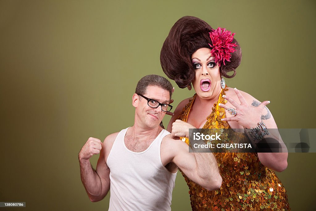 Man with Drag Queen Shocked tall drag queen with short muscular man Eccentric Stock Photo