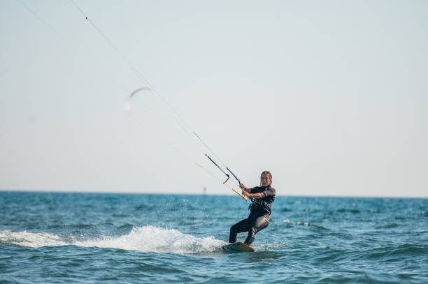 istock Woman kitesurfing on the ocean waters 1380857786