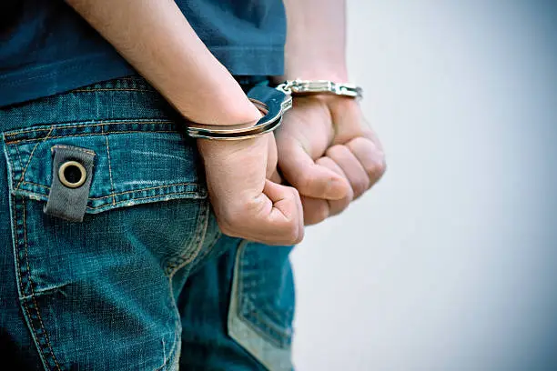 Photo of teenager under arrest