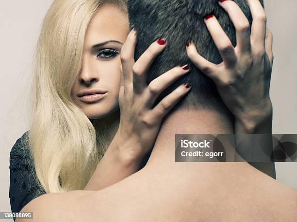 Blonde Caucasian Woman Grabbing Back Of Mans Head Sensually Stock Photo - Download Image Now