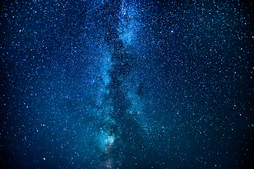 Summer starry sky. Stars on the sky. Beautiful night landscape. Long exposure. Milky way. Abstract background. Deep space