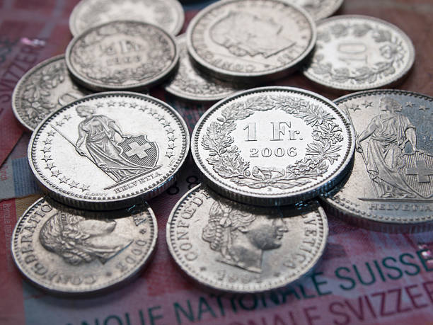 istock Shining Swiss Franc coins on 20 Swiss Franc bank notes 138090318