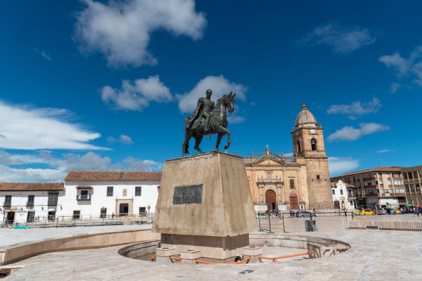 Monument of Simon Bolivar in the square with colonial style architecture in the city of Tunja. Colombia. Monument of Simon Bolivar in the main square of the city of Tunja with a catholic church in the background. Boyaca. Colombia . May 24, 2019. boyacá department photos stock pictures, royalty-free photos & images