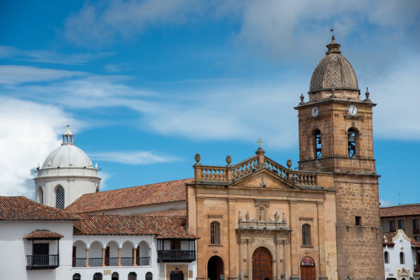 Bell tower facade with clock of a church in the city of Tunja .Colombia. Facade of the church with a colonial-style bell tower in a square in the city of Tunja, Boyacá. Colombia. May 24, 2019 boyacá department photos stock pictures, royalty-free photos & images