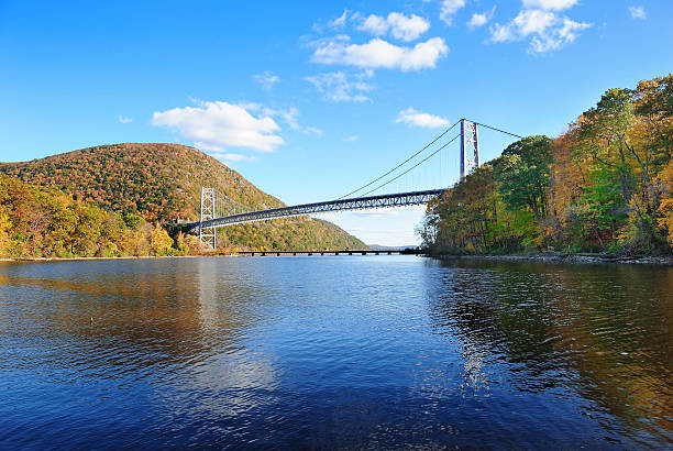 Bear Mountain Bear Mountain with Hudson River and bridge in Autumn with colorful foliage and water reflection. hudson river photos stock pictures, royalty-free photos & images