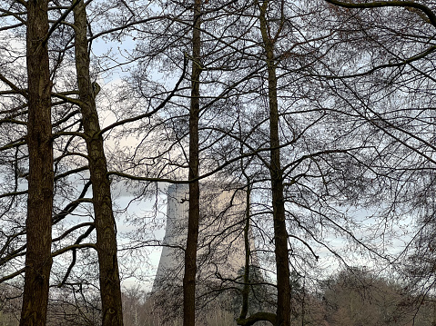 View of a nuclear power plant through trees.