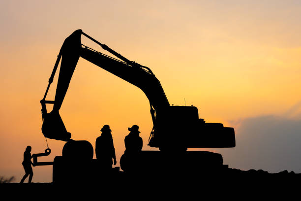 istock Silhouette of Construction site with road construction worker and excavator 1380957875